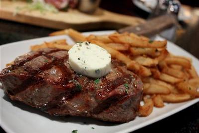 steak with herb butter with chips