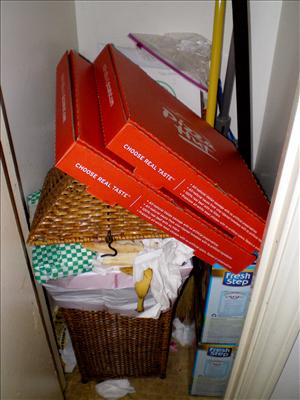 Overflowing trash/At least it's in a closet out of the way