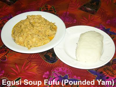 A Plate of egusi soup with Pounded yam,Bush meat and okporoko.(no pure water sha)