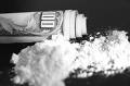Cocaine and a rolled up $100 bill