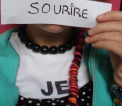 sourir ecrit