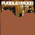 A Puddle of Mudd CD in a puddle of mud