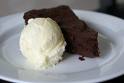 Chocolate cake with a scoop of vanilla ice cream on top